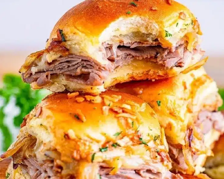 Delicious French Dip Sliders with tender beef and au jus for dipping.