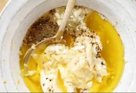 Homemade Caesar Salad Dressing in a glass bowl ready for serving.