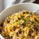Cheesy ground beef and rice casserole in a baking dish