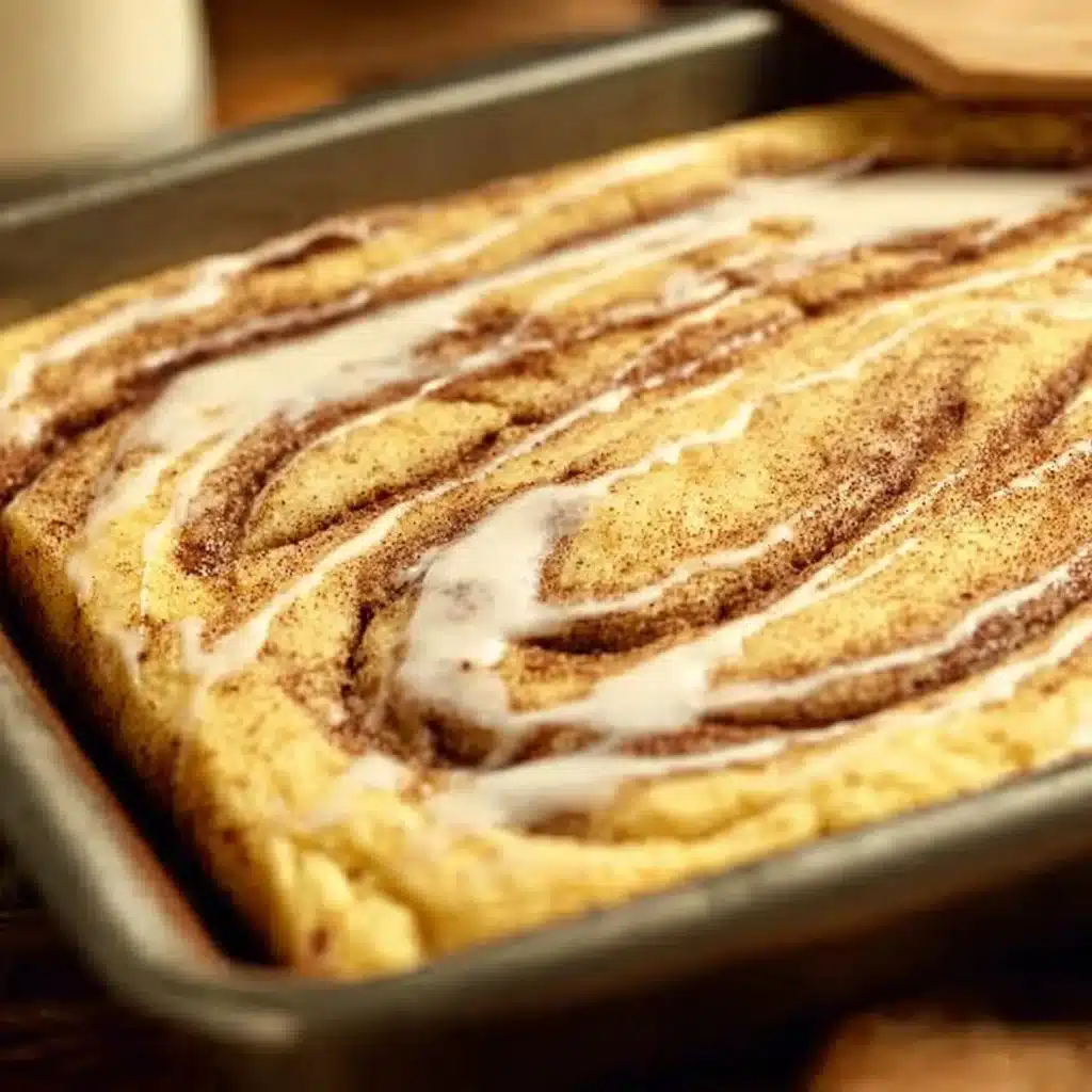 Delicious cinnamon swirl sheet pan pancakes served on a plate