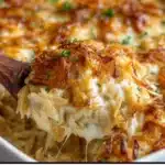 Delicious French Onion Chicken Orzo Casserole with melted cheese and fresh herbs