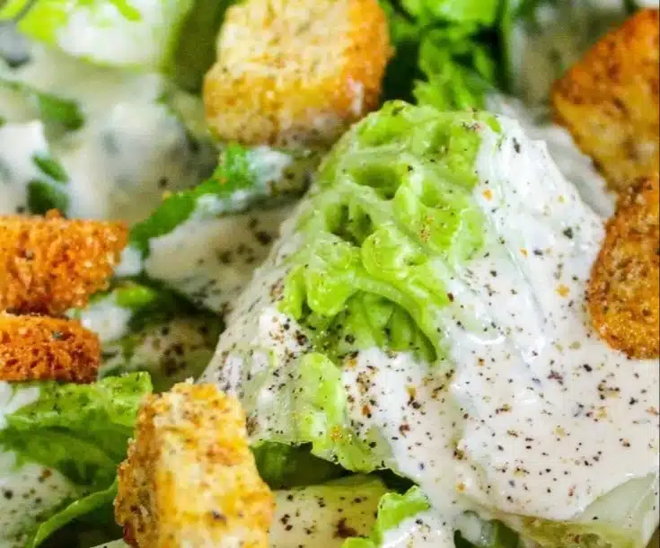 A bowl of homemade Caesar salad dressing without raw anchovies