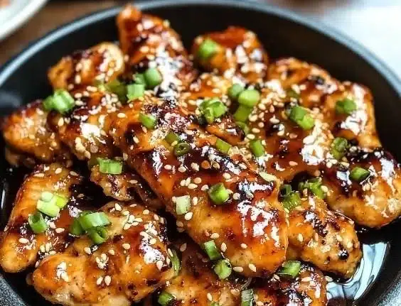 Delicious Korean Chicken Breasts garnished with sesame seeds and scallions