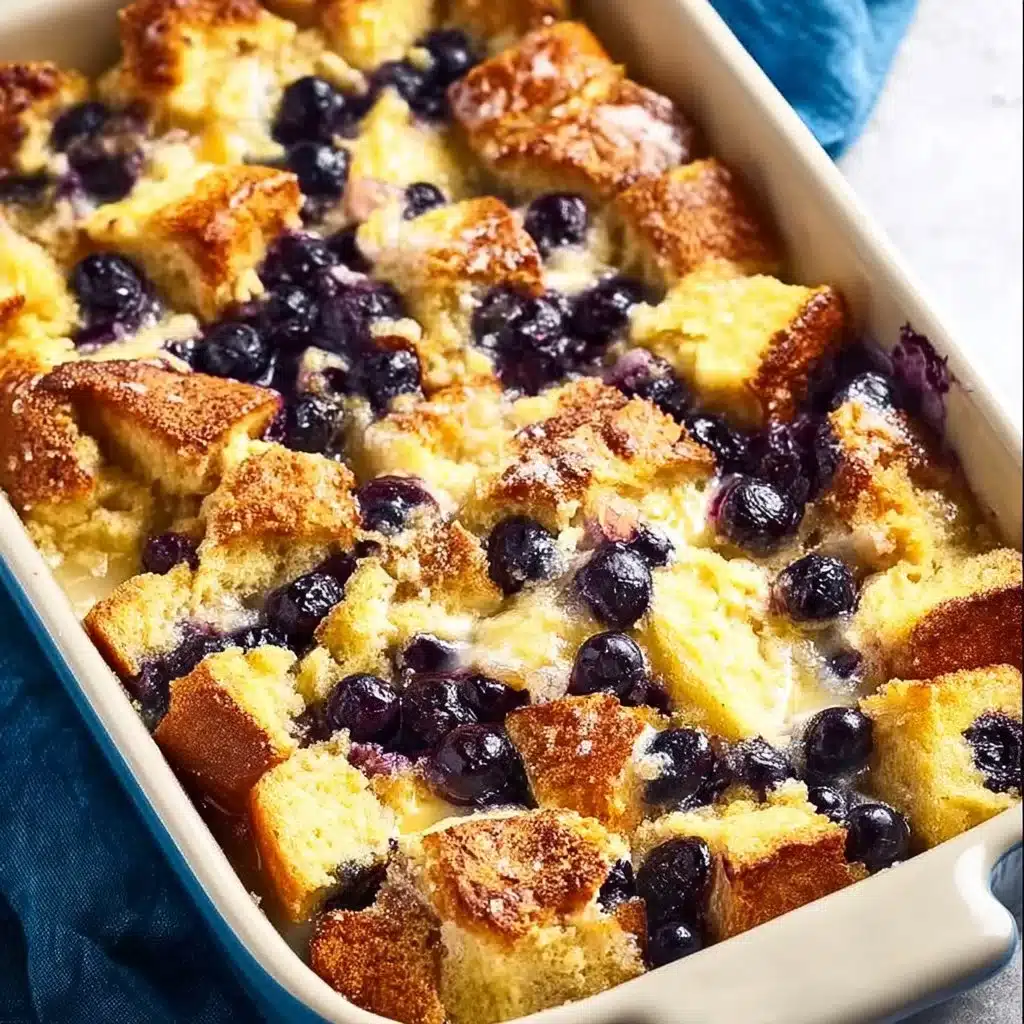 Delicious blueberry french toast casserole served on a plate with syrup.