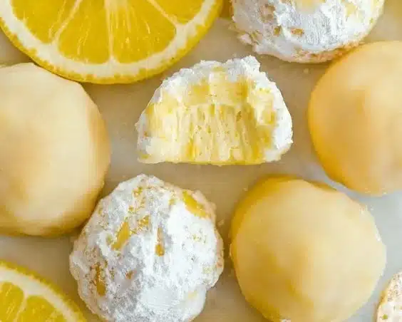 Homemade 3 ingredient lemon truffles on a plate, a zesty dessert idea.