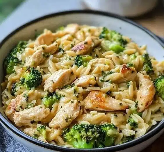 Creamy cheesy chicken with broccoli and orzo in a delicious dish