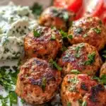 Greek Turkey Meatballs served with tzatziki sauce on a rustic plate