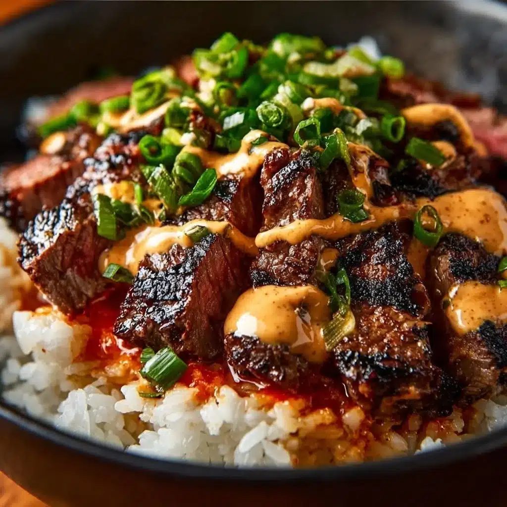 Korean BBQ steak rice bowl garnished with fresh vegetables and sauce