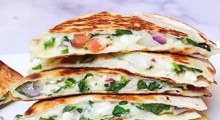Mediterranean Quesadilla with spinach, feta cheese, and mozzarella on a plate