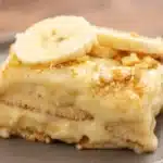 Old-fashioned homemade banana pudding topped with whipped cream and banana slices
