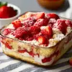 Delicious strawberry cheesecake dump cake ready to serve
