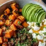 Viral Ground Beef Hot Honey Bowl garnished with fresh herbs and chilies