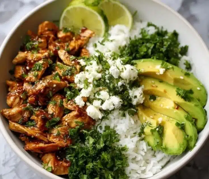 Honey lime chicken served over avocado rice in a vibrant bowl